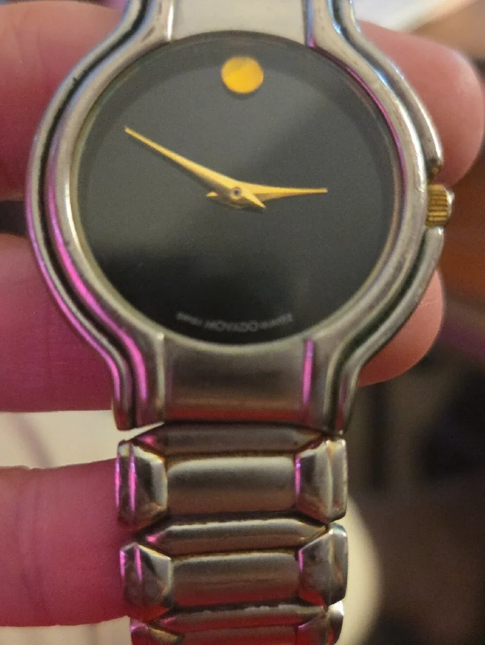 Movado Black Dial Watch with Gold Hands and Dot